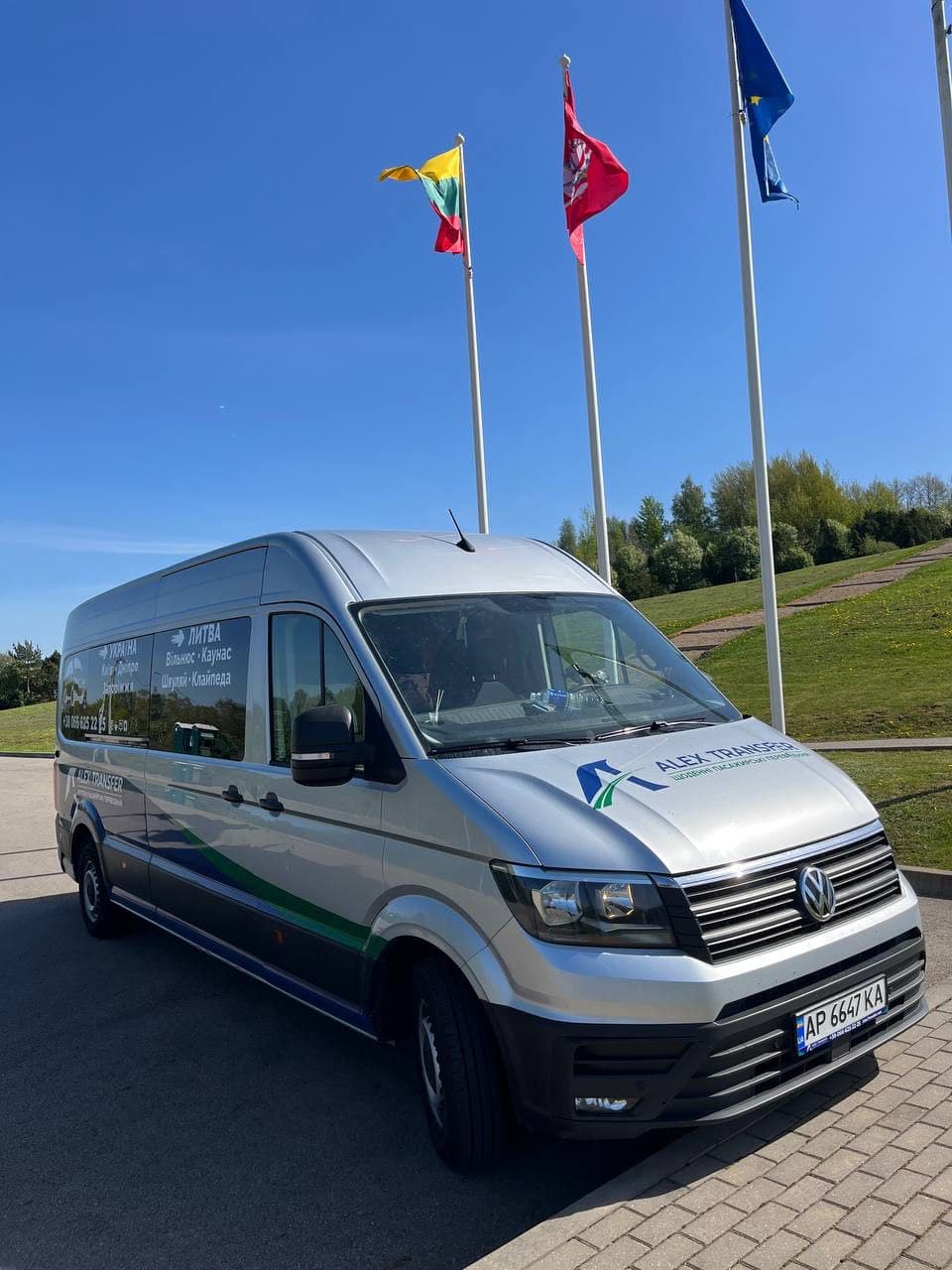 VW Crafter in front of Lithuanian and EU flags